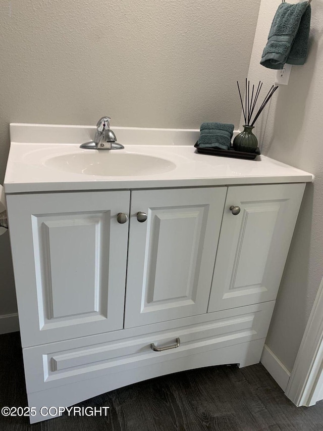 room details with wood finished floors and vanity