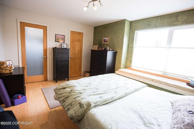 bedroom with light wood-style flooring