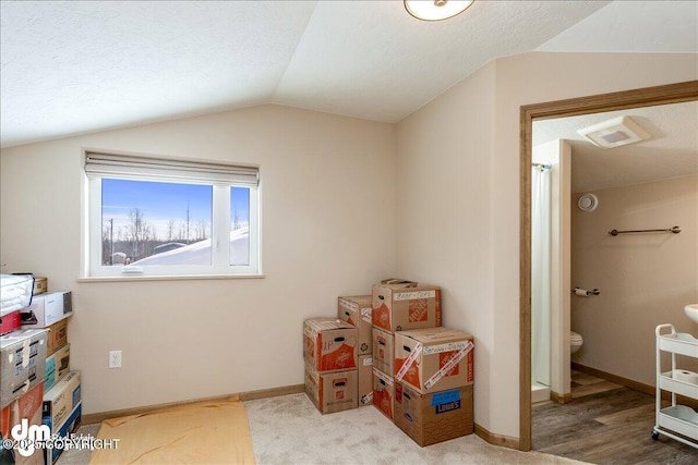 game room with lofted ceiling, a textured ceiling, wood finished floors, and baseboards