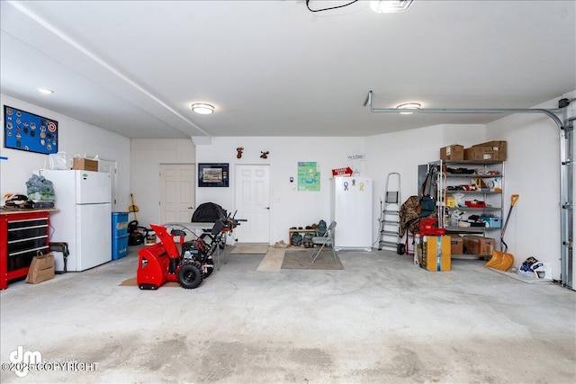 garage with freestanding refrigerator