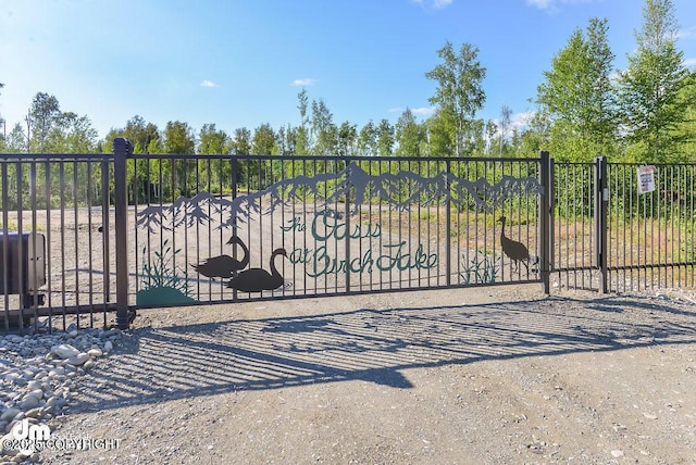 view of gate with fence