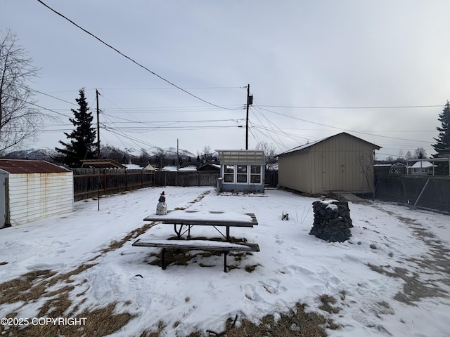 exterior space with a shed, an outdoor structure, and a fenced backyard