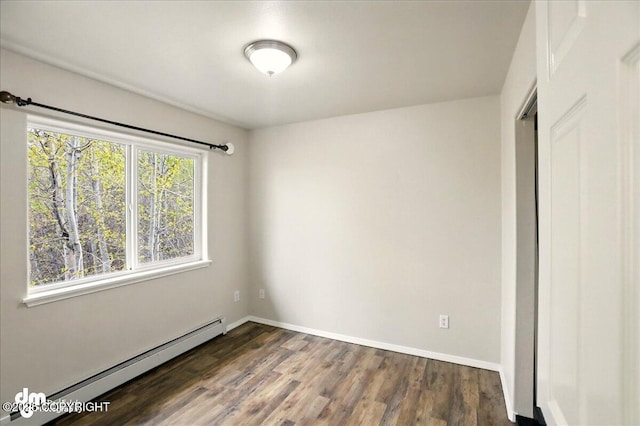 unfurnished bedroom featuring a baseboard radiator, dark wood-style flooring, and baseboards