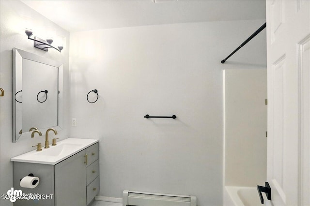 bathroom featuring a baseboard radiator, vanity, tub / shower combination, and toilet