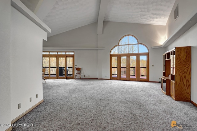 unfurnished living room featuring high vaulted ceiling, baseboards, french doors, beam ceiling, and carpet