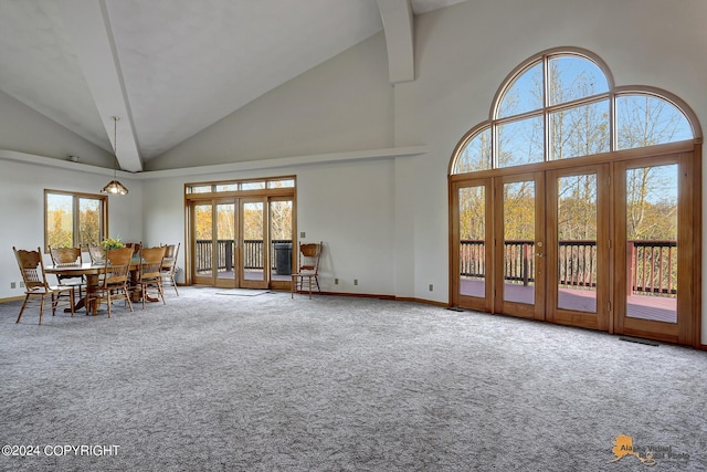 unfurnished living room with carpet floors, french doors, visible vents, and baseboards