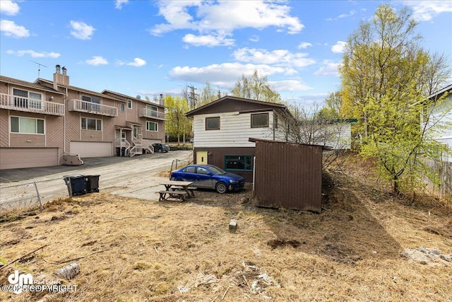 541 E 22nd Ave, Anchorage, AK 99503 - view of yard featuring concrete driveway and an attached garage