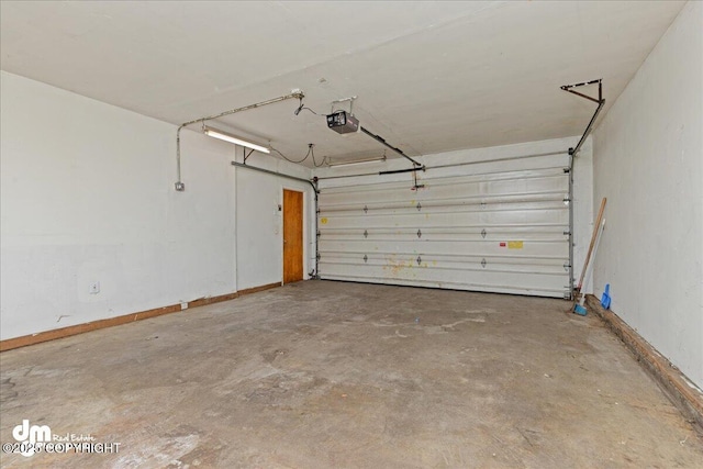 541 E 22nd Ave, Anchorage, AK 99503 - garage featuring a garage door opener and baseboards