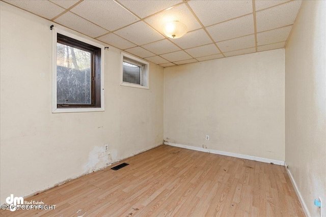 541 E 22nd Ave, Anchorage, AK 99503 - empty room with wood finished floors and a paneled ceiling