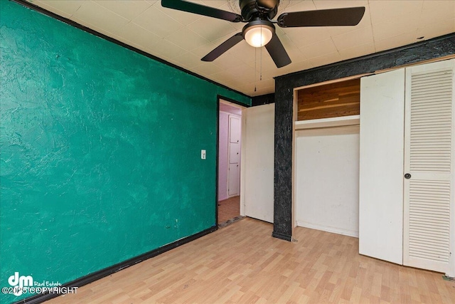 541 E 22nd Ave, Anchorage, AK 99503 - unfurnished bedroom featuring light wood-style flooring, ceiling fan, a closet, and baseboards