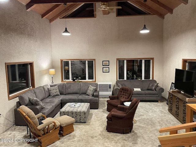 living area with a textured wall, wooden ceiling, carpet flooring, and beamed ceiling