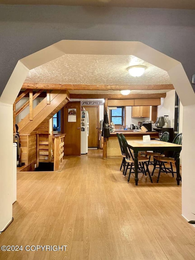 unfurnished dining area with light wood-type flooring