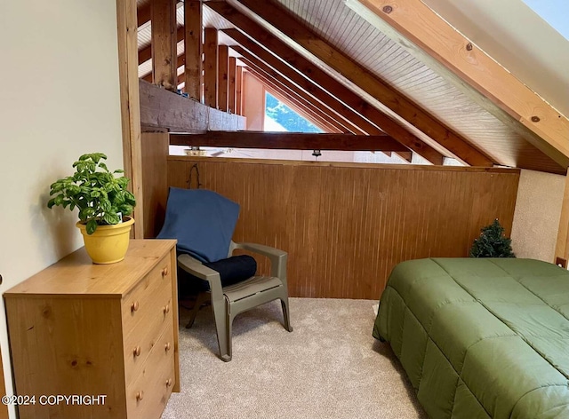 bedroom with light carpet and lofted ceiling with beams