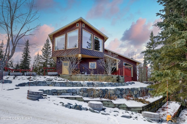 contemporary home with a standing seam roof and metal roof