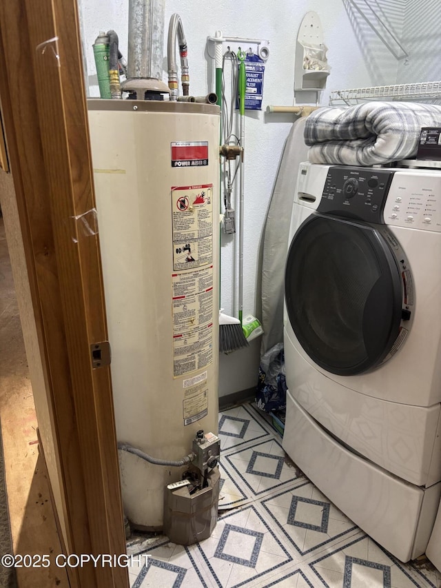 washroom featuring gas water heater and washer / clothes dryer