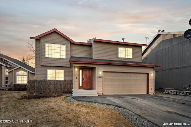 view of front of property featuring driveway and an attached garage