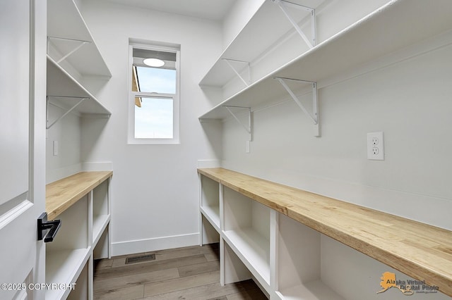 interior space featuring visible vents and wood finished floors