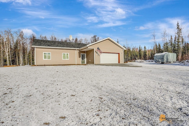 ranch-style home featuring an attached garage