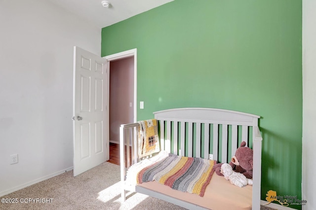 carpeted bedroom with baseboards