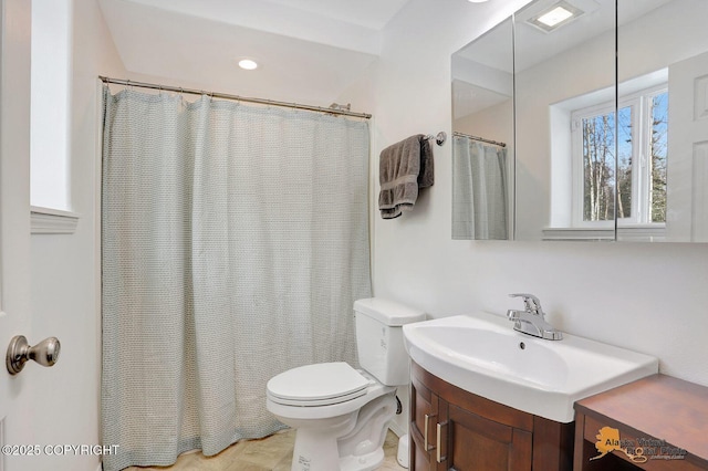 bathroom featuring recessed lighting, vanity, and toilet