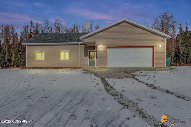 ranch-style home featuring an attached garage