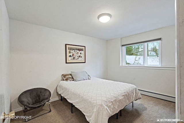 bedroom with carpet, a baseboard radiator, and baseboards