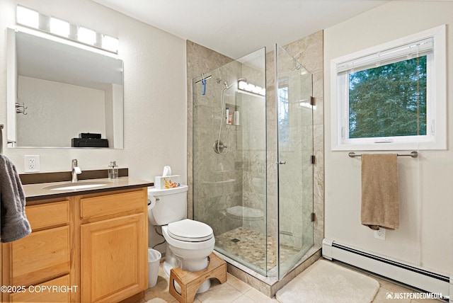 full bathroom featuring toilet, a baseboard radiator, tile patterned flooring, vanity, and a shower stall