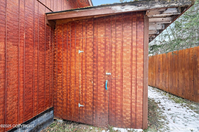 view of outbuilding with fence