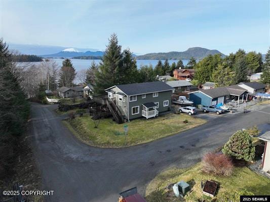 birds eye view of property featuring a mountain view