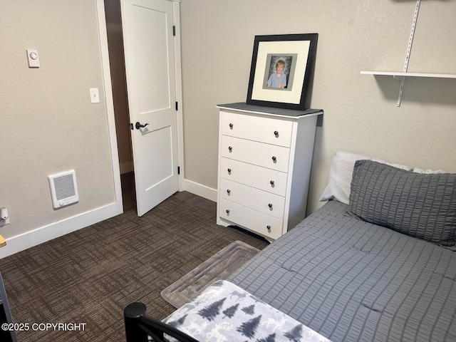 bedroom featuring baseboards, visible vents, and dark carpet