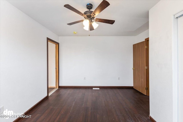 2050 Totem Rd, Wasilla, AK 99654 - empty room featuring dark wood-style flooring, a ceiling fan, and baseboards