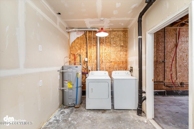 2050 Totem Rd, Wasilla, AK 99654 - washroom featuring strapped water heater, independent washer and dryer, and laundry area