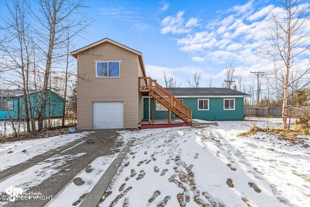 2050 Totem Rd, Wasilla, AK 99654 - view of front of home featuring a garage and stairs