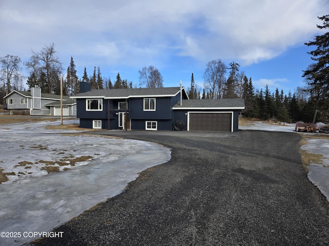 bi-level home featuring driveway