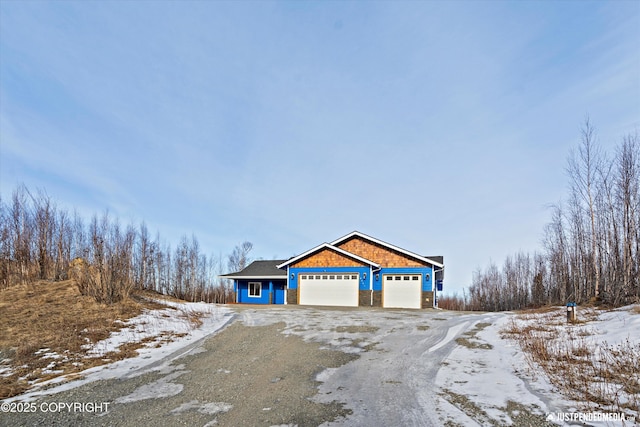 view of front of home featuring a garage and driveway