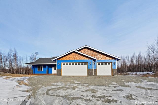 view of front of home with driveway and an attached garage