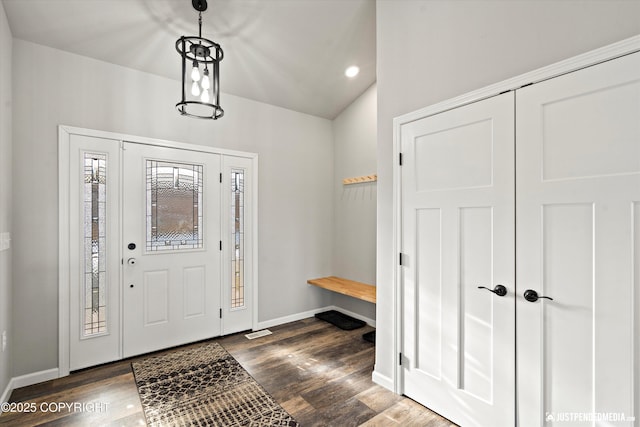 foyer entrance with dark wood-style floors, baseboards, and recessed lighting