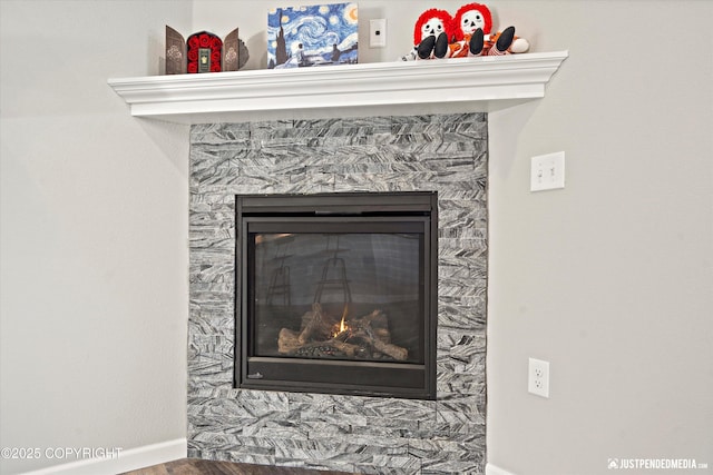 room details with a fireplace and baseboards