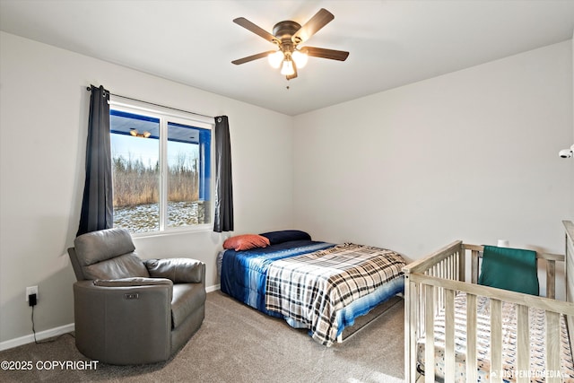 bedroom featuring carpet floors, baseboards, and a ceiling fan