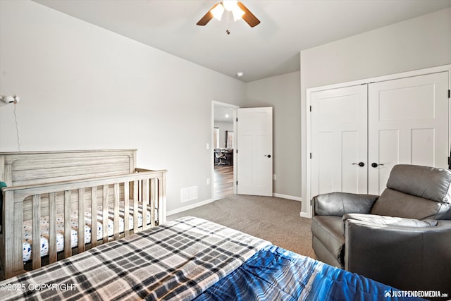 bedroom featuring a ceiling fan, visible vents, baseboards, a closet, and carpet