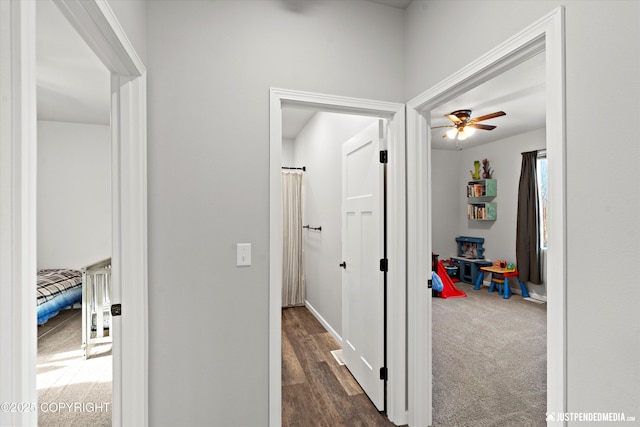 hallway with dark carpet