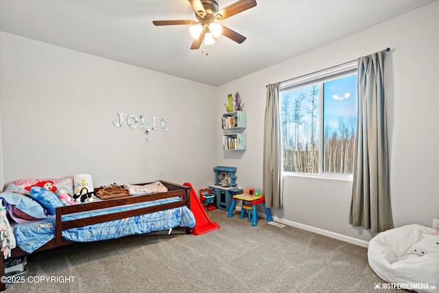 bedroom featuring ceiling fan, carpet, and baseboards