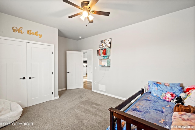 carpeted bedroom with a ceiling fan, a closet, visible vents, and baseboards