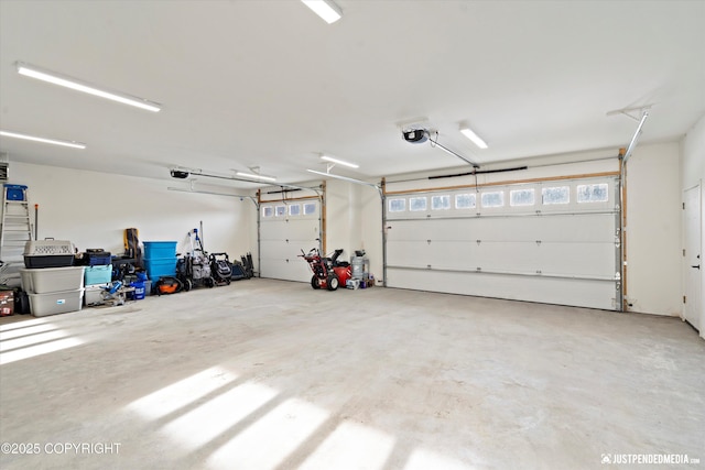 garage featuring a garage door opener