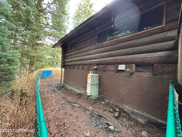 view of side of home featuring log siding