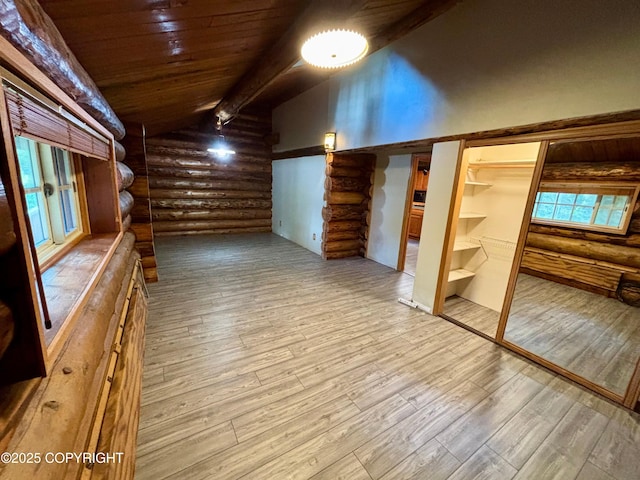 bonus room featuring wooden ceiling, vaulted ceiling with beams, and wood finished floors