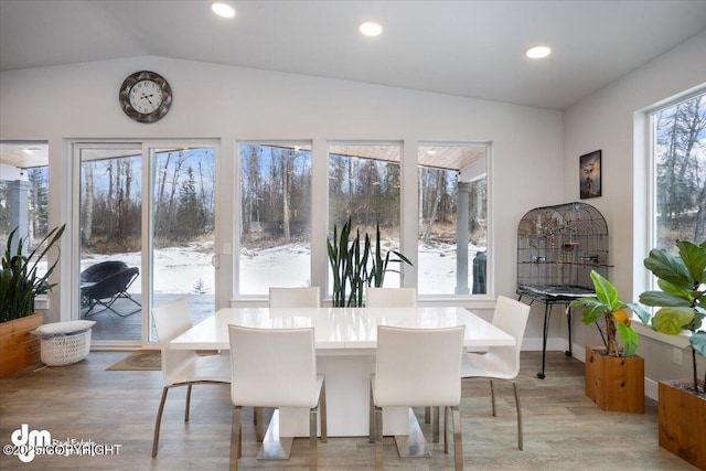 dining room with vaulted ceiling, light wood finished floors, baseboards, and recessed lighting