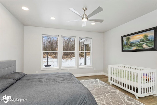 bedroom featuring ceiling fan, baseboards, wood finished floors, and recessed lighting