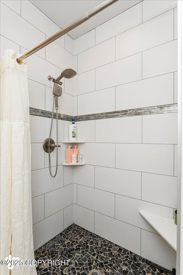 bathroom with tiled shower