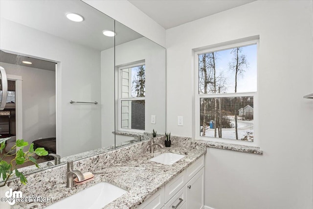 bathroom featuring double vanity and a sink